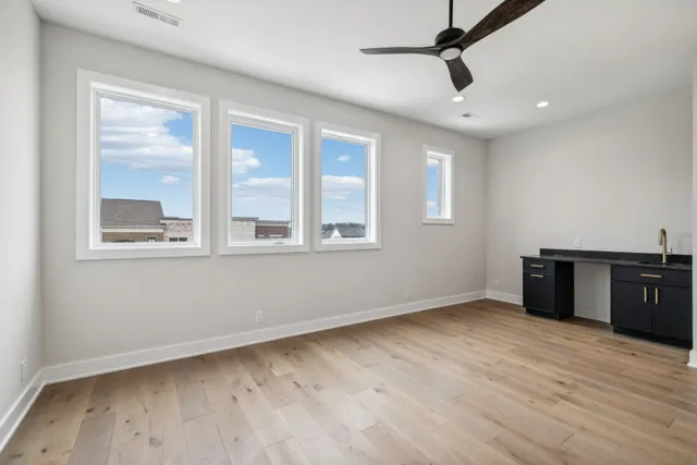 a large brick building with a yard in front of it