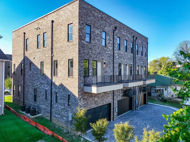 a view of a brick building with many windows
