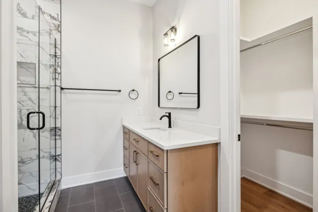 a bathroom with a sink and a mirror
