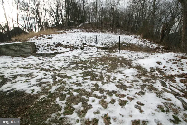 a view of a yard covered in snow