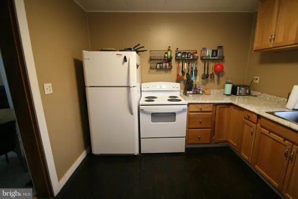a utility room with sink dryer and washer