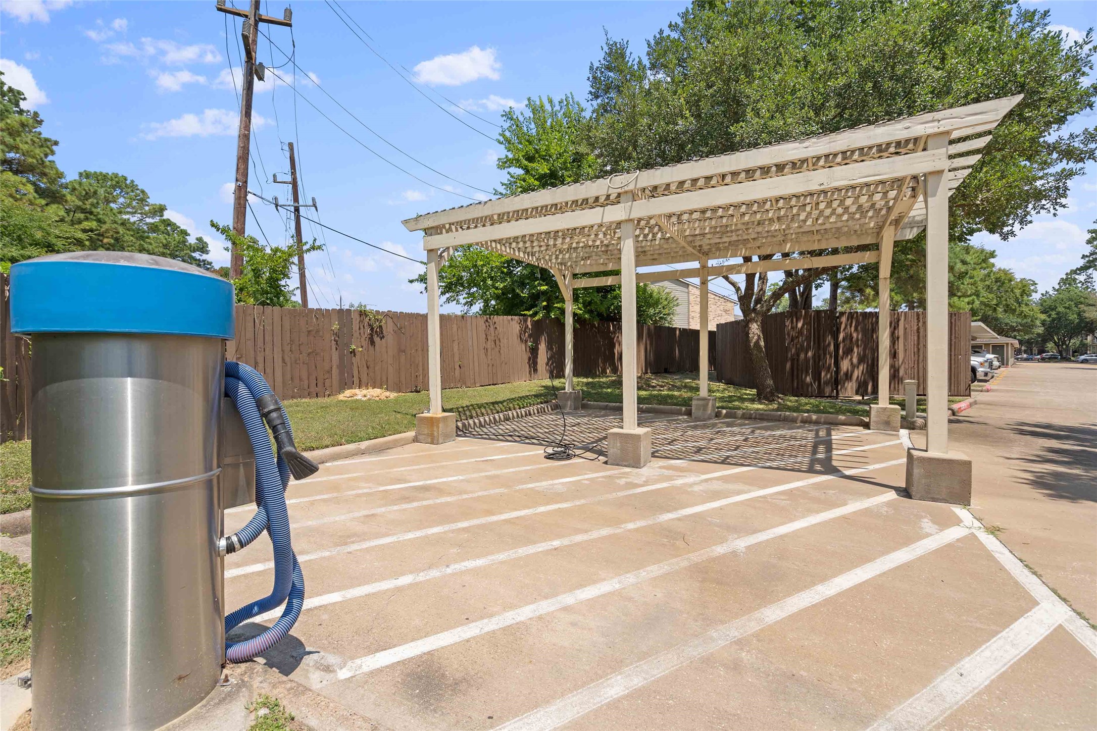 2400-635 Spring Rain Drive Spring, TX 77379 - Photo 22 of 35 a view of a house with floor to ceiling windows and a basket ball poll