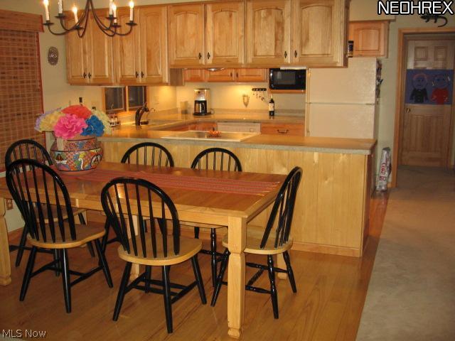 5838 Fairland Road Clinton, OH 44216 - Photo 13 of 25 DINING ROOM TO TOTALLY REHABBED KITCHEN - BACK HALL HAS FULL BATH AND BEDRM
