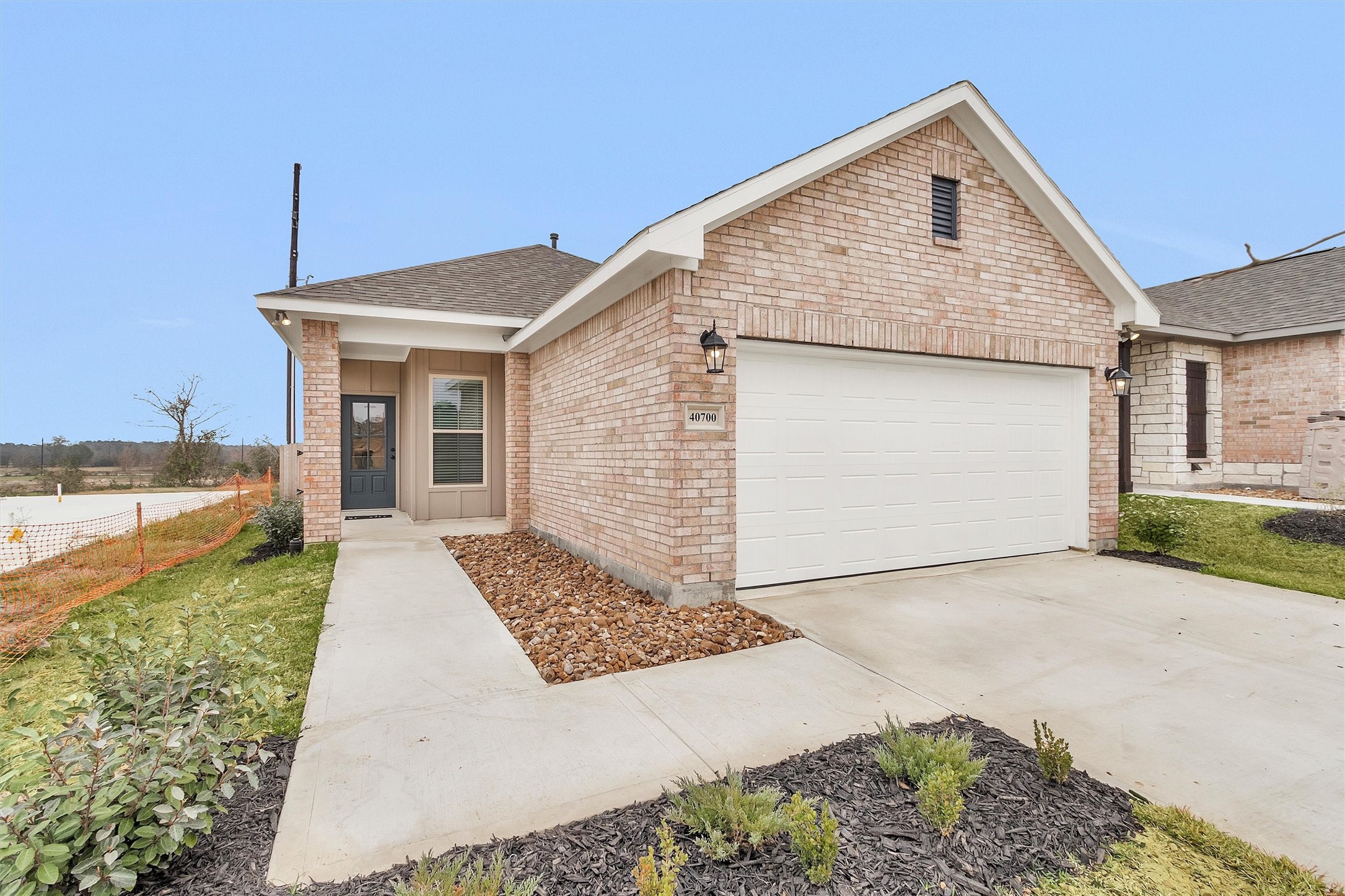 40700 Pessi Road Magnolia, TX 77354 - Photo 2 of 29 a front view of a house with a yard