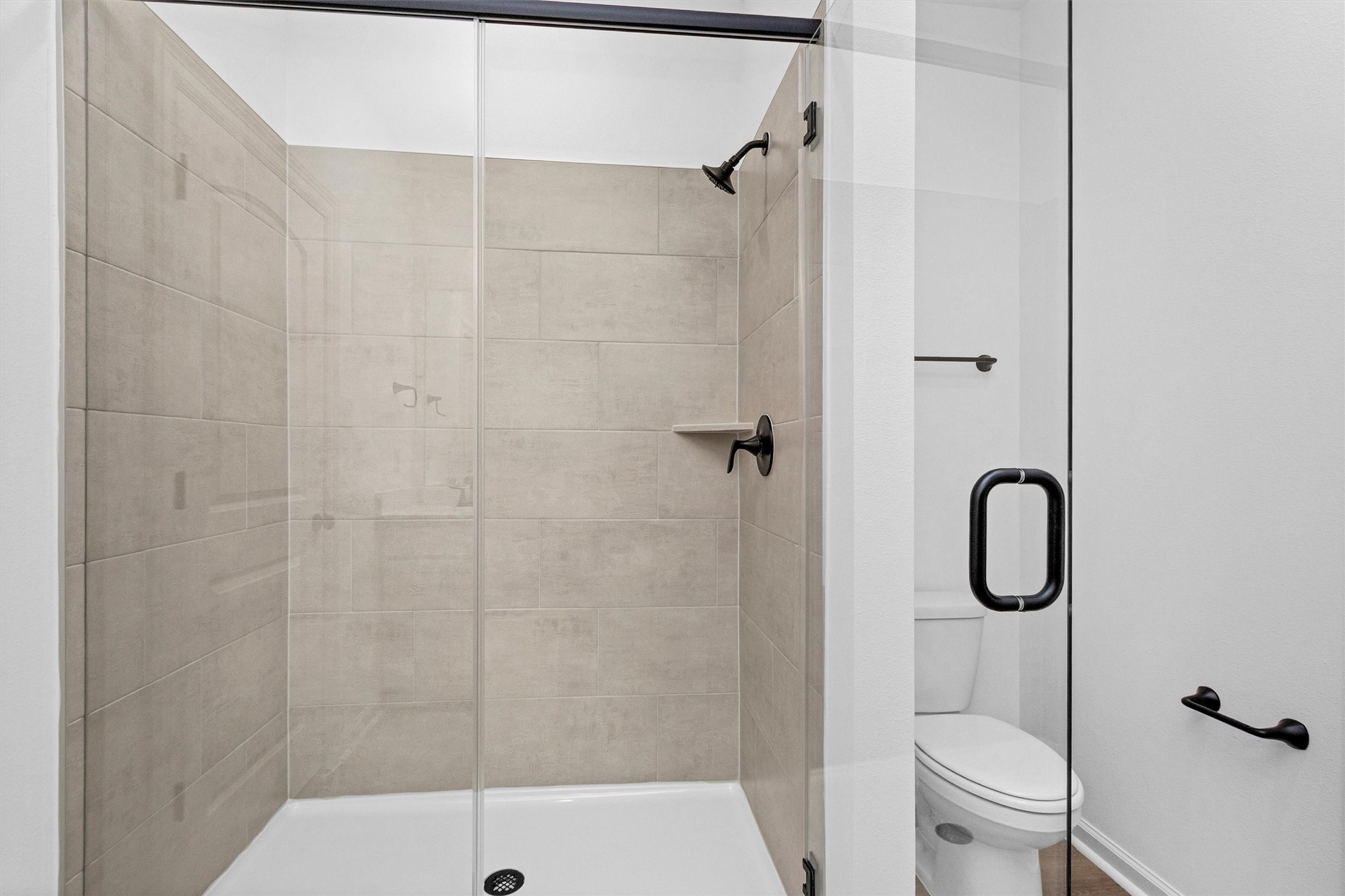 40700 Pessi Road Magnolia, TX 77354 - Photo 25 of 29 a bathroom with a toilet and a shower