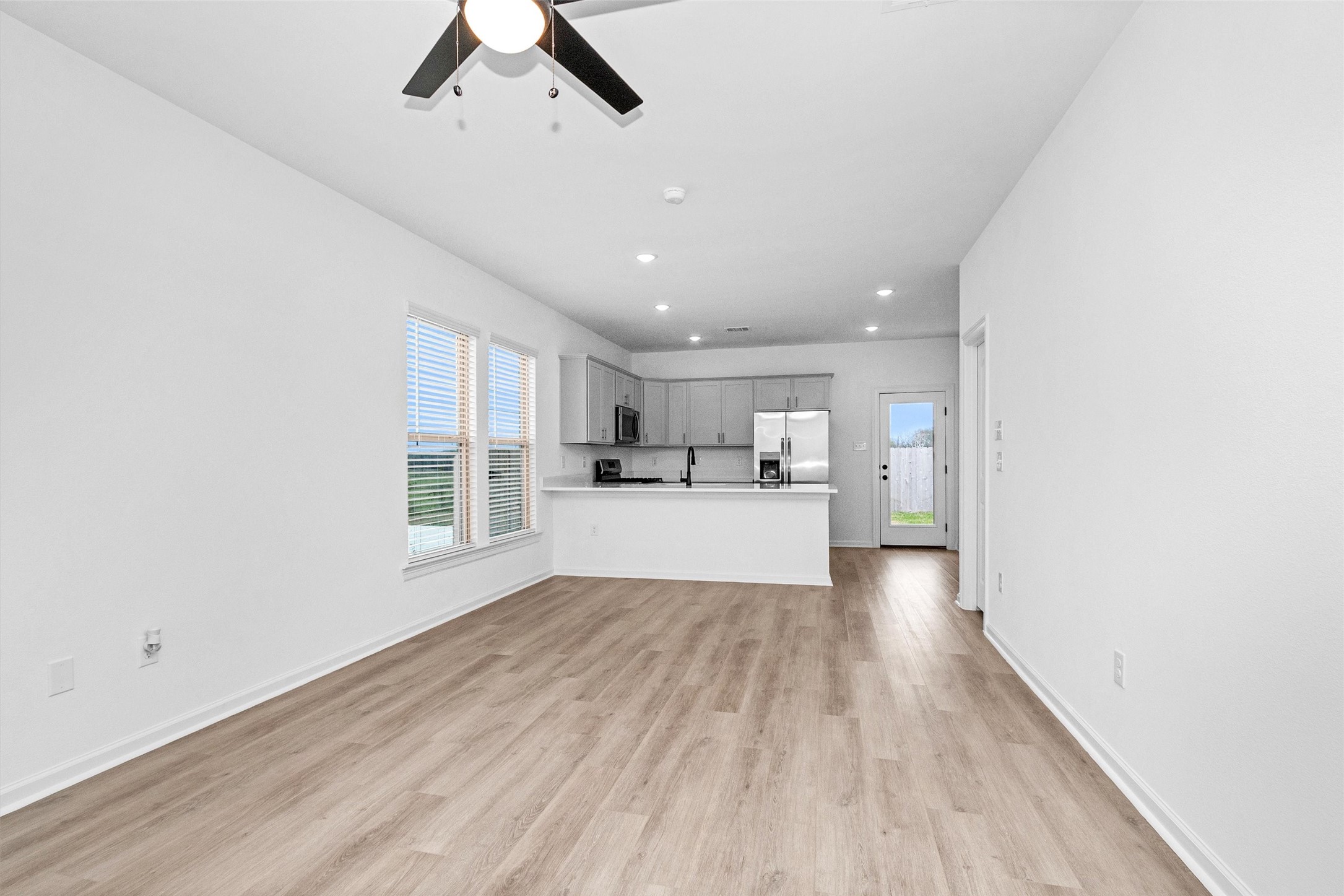 40700 Pessi Road Magnolia, TX 77354 - Photo 4 of 29 a view of a kitchen with wooden floor