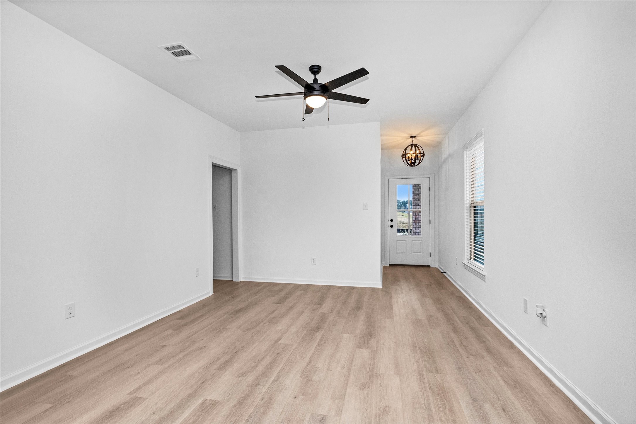 40700 Pessi Road Magnolia, TX 77354 - Photo 5 of 29 wooden floor in an empty room with a window