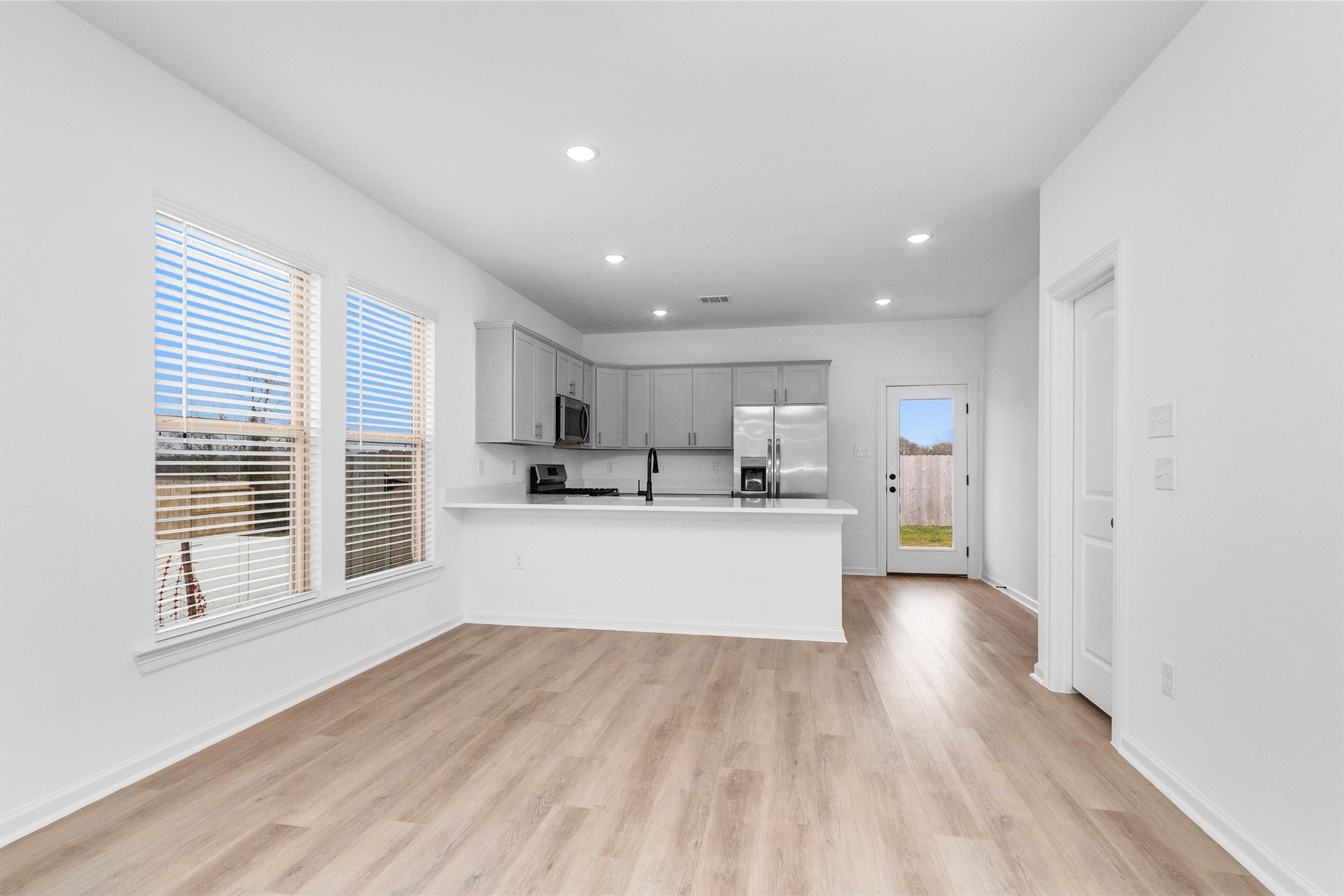 40700 Pessi Road Magnolia, TX 77354 - Photo 6 of 29 a view of kitchen and kitchen with sink