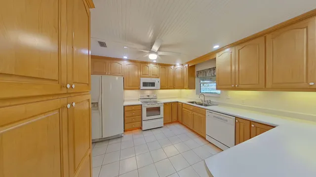 a view of a livingroom with furniture and a window