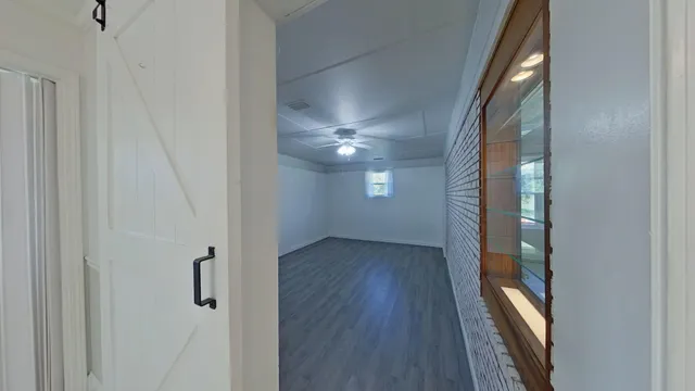 a bedroom with a bed and a potted plant