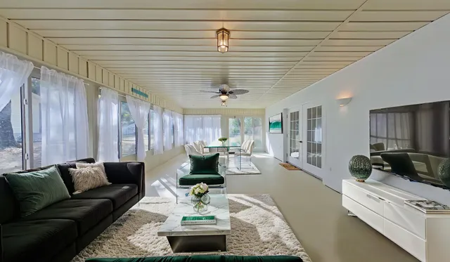 a view of a house with swimming pool and a yard