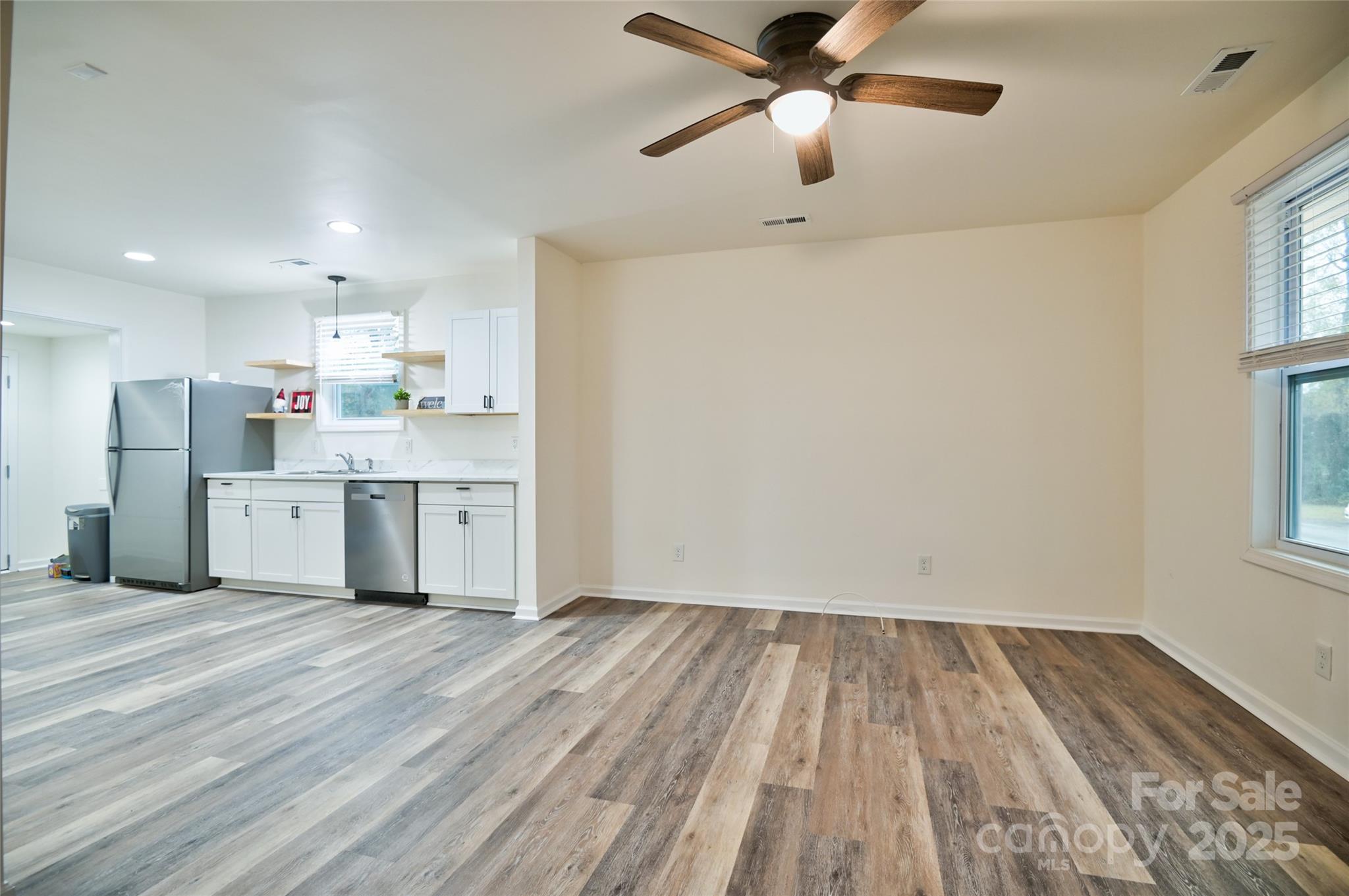 313 Heyward Street Rock Hill, SC 29730 - Photo 12 of 29 a view of kitchen with wooden floor electronic appliances and window