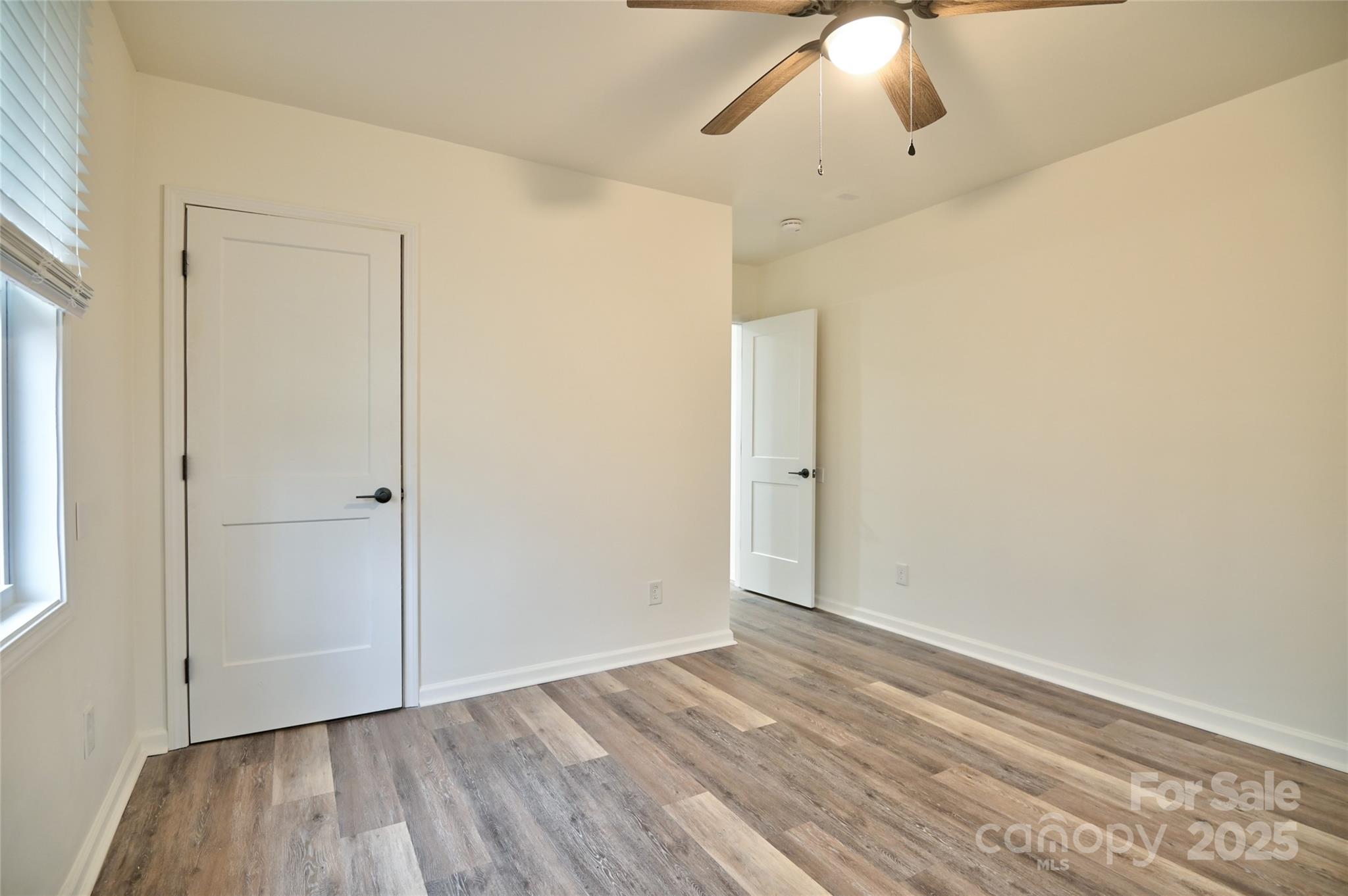 313 Heyward Street Rock Hill, SC 29730 - Photo 17 of 29 a view of an empty room with wooden floor