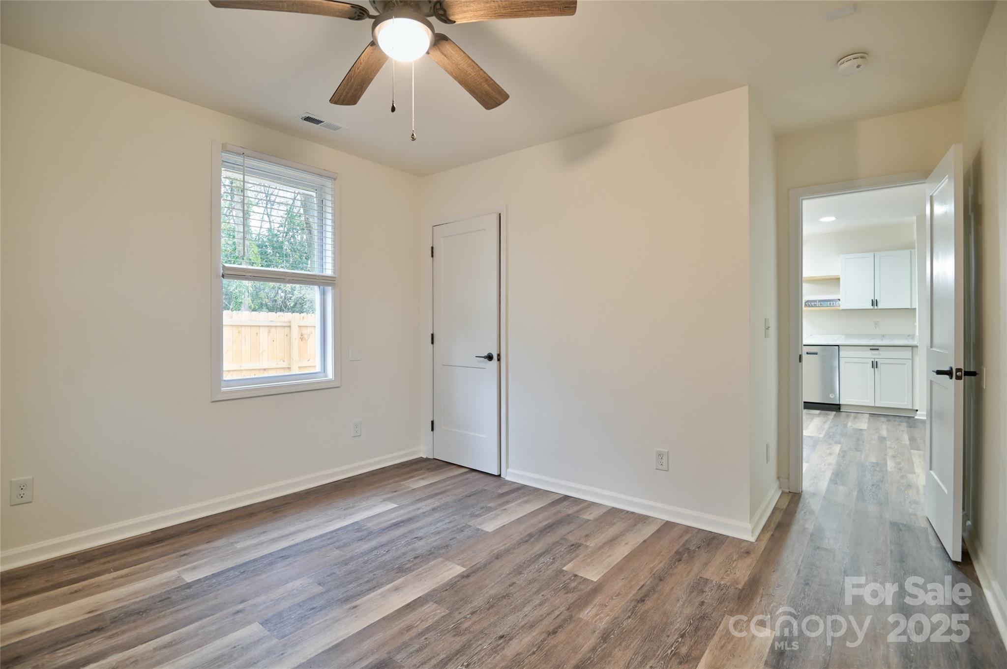 313 Heyward Street Rock Hill, SC 29730 - Photo 18 of 29 a view of empty room with wooden floor and fan