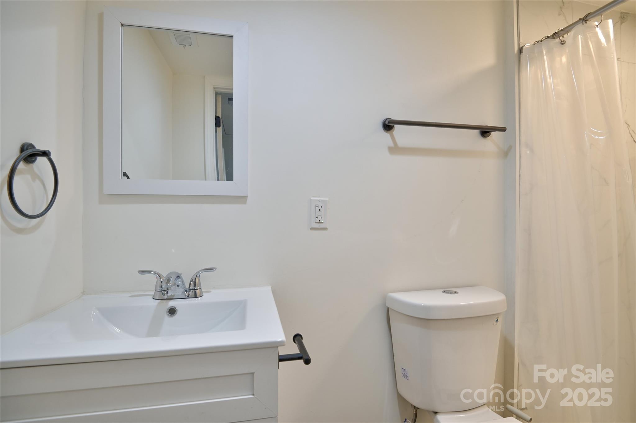 313 Heyward Street Rock Hill, SC 29730 - Photo 19 of 29 a bathroom with a sink a toilet and shower