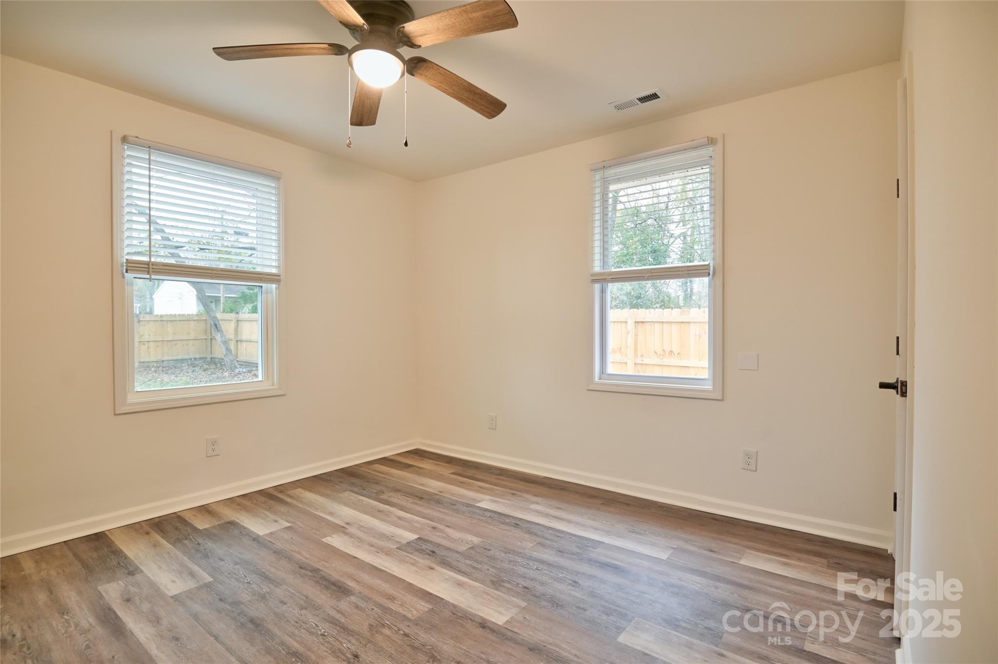 313 Heyward Street Rock Hill, SC 29730 - Photo 6 of 29 a view of empty room with wooden floor and fan