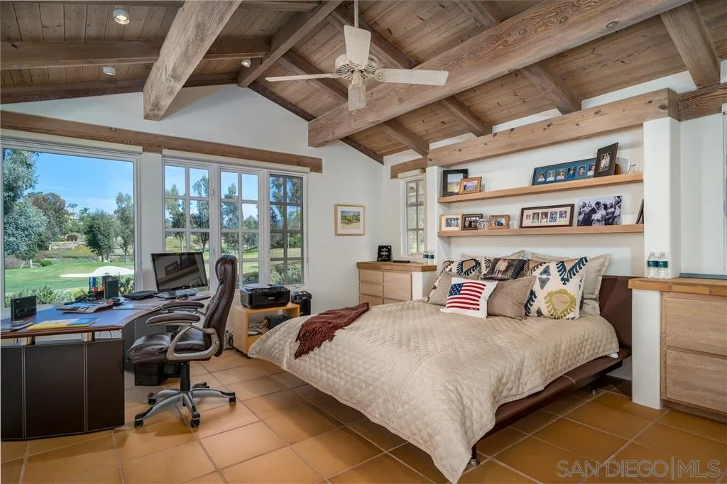 6146 Paseo Valencia Rancho Santa Fe, CA 92067 - Photo 15 of 25 a bedroom with a bed a table and chairs