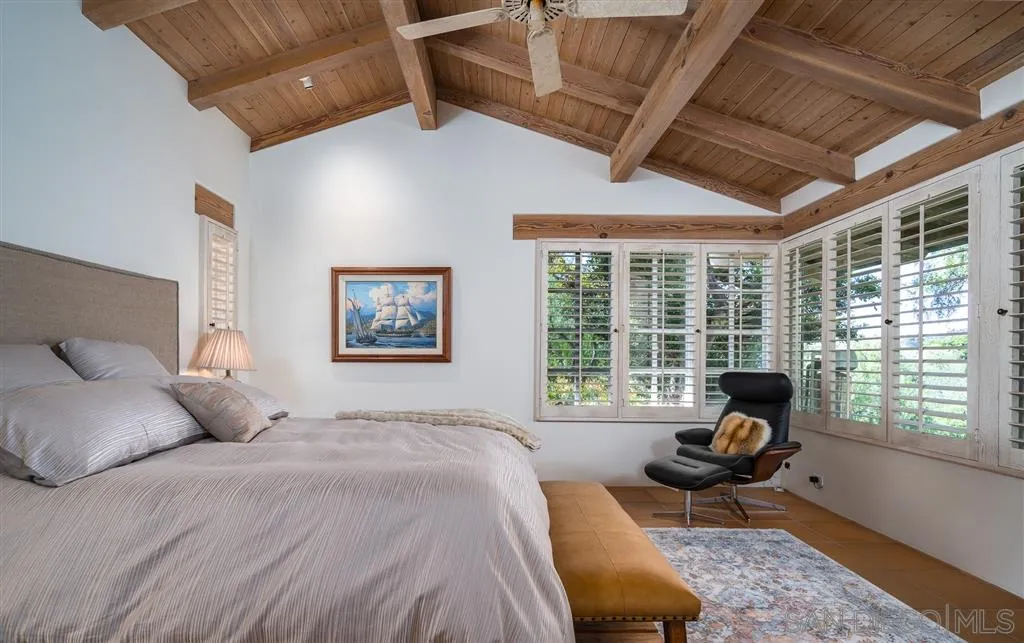 6146 Paseo Valencia Rancho Santa Fe, CA 92067 - Photo 16 of 25 a bedroom with a bed and wooden floor