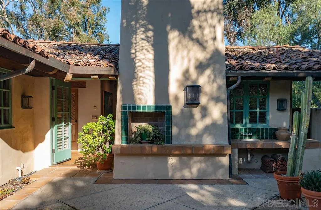 6146 Paseo Valencia Rancho Santa Fe, CA 92067 - Photo 17 of 25 a view of brick house with potted plants