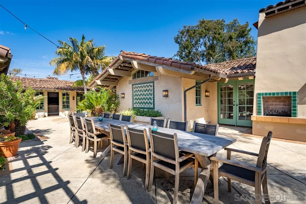 6146 Paseo Valencia Rancho Santa Fe, CA 92067 - Photo 18 of 25 a view of a patio with table and chairs and potted plants