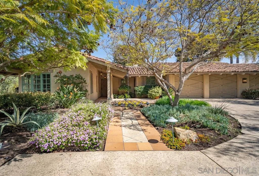 6146 Paseo Valencia Rancho Santa Fe, CA 92067 - Photo 20 of 25 front view of a house with a bench