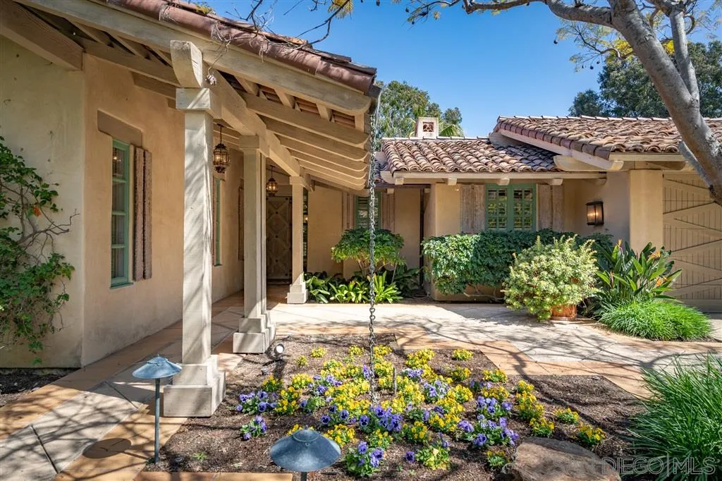6146 Paseo Valencia Rancho Santa Fe, CA 92067 - Photo 22 of 25 a front view of a house with a yard