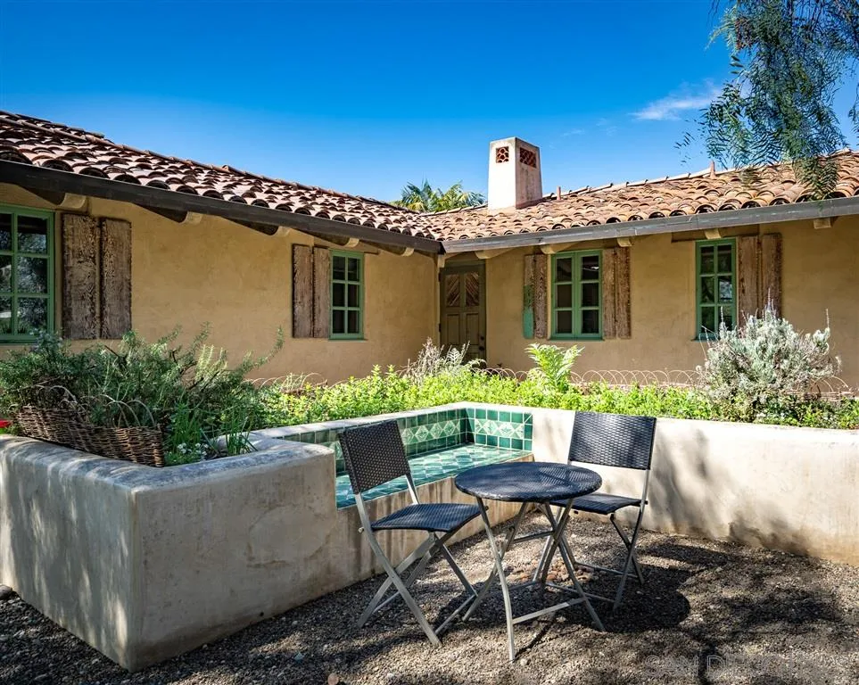 6146 Paseo Valencia Rancho Santa Fe, CA 92067 - Photo 25 of 25 a view of a patio with table and chairs and potted plants