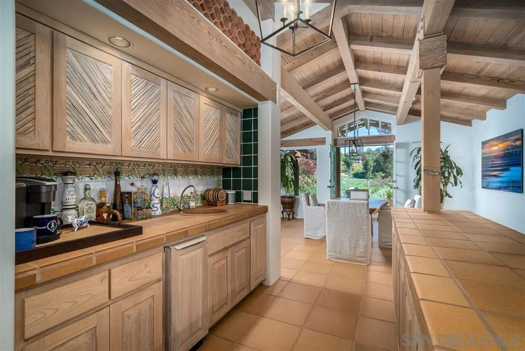 6146 Paseo Valencia Rancho Santa Fe, CA 92067 - Photo 6 of 25 a kitchen with a sink and cabinets