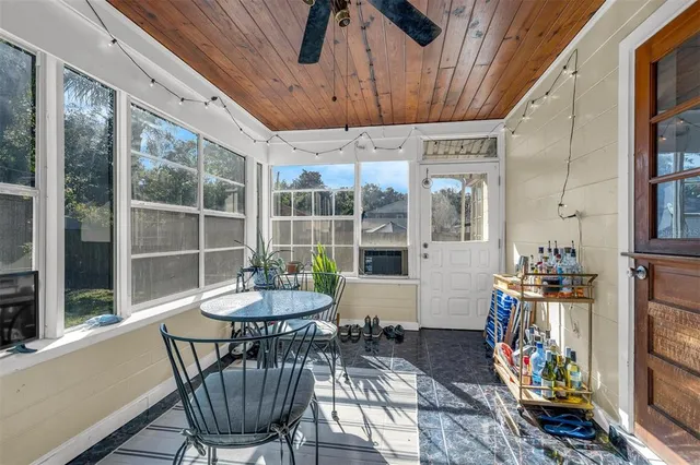 a dining room with furniture a rug and wooden floor