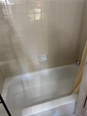 a view of a bathtub in a bathroom