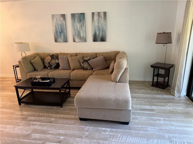 a living room with a couch and a table