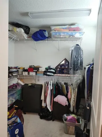 a store room with lots of different colored cloths