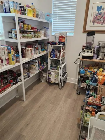 a view of a workspace with furniture