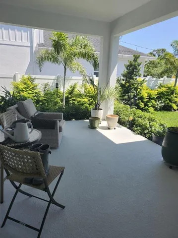 a view of a chairs and table in the patio