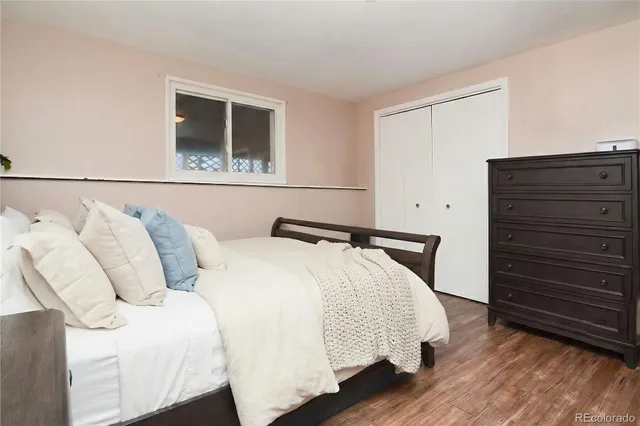 a bedroom with a bed and a mirror