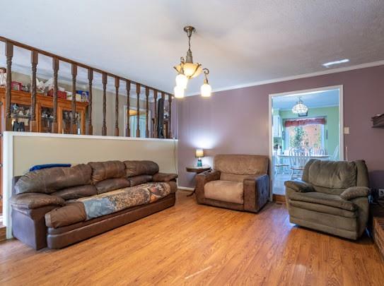 165 Lake Creek Road Cedartown, GA 30125 - Photo 15 of 28 a living room with couches a fireplace and a dining table with wooden floor