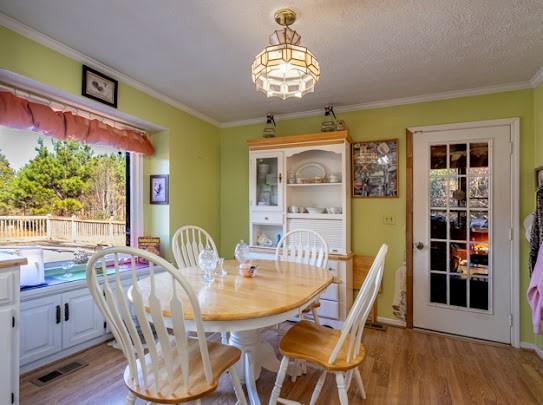 165 Lake Creek Road Cedartown, GA 30125 - Photo 19 of 28 a dining room with furniture a window and wooden floor