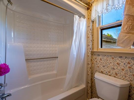 165 Lake Creek Road Cedartown, GA 30125 - Photo 28 of 28 a bathroom with a toilet and a shower