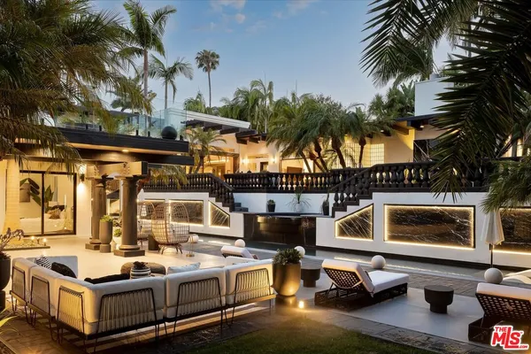 a view of a patio with swimming pool table and chairs