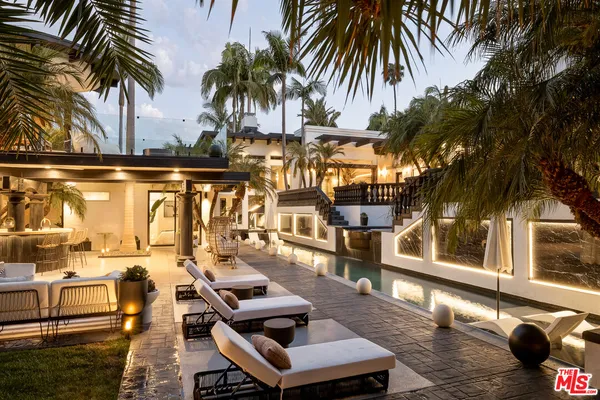 a view of a roof deck with palm trees