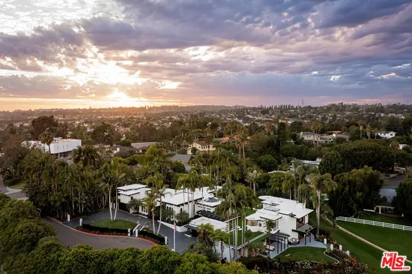 an aerial view of a house with outdoor space