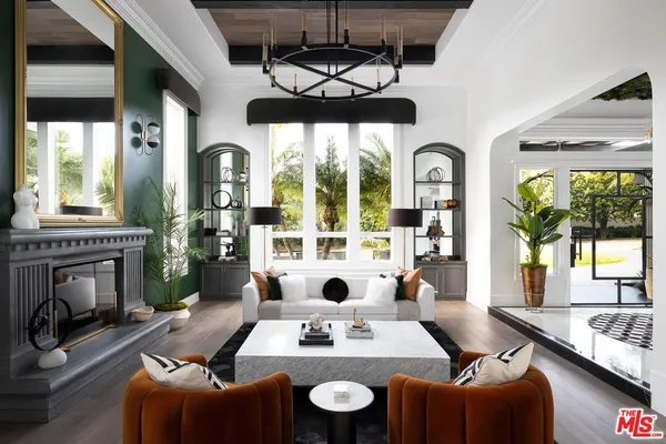 a view of a dining room with furniture large windows and wooden floor