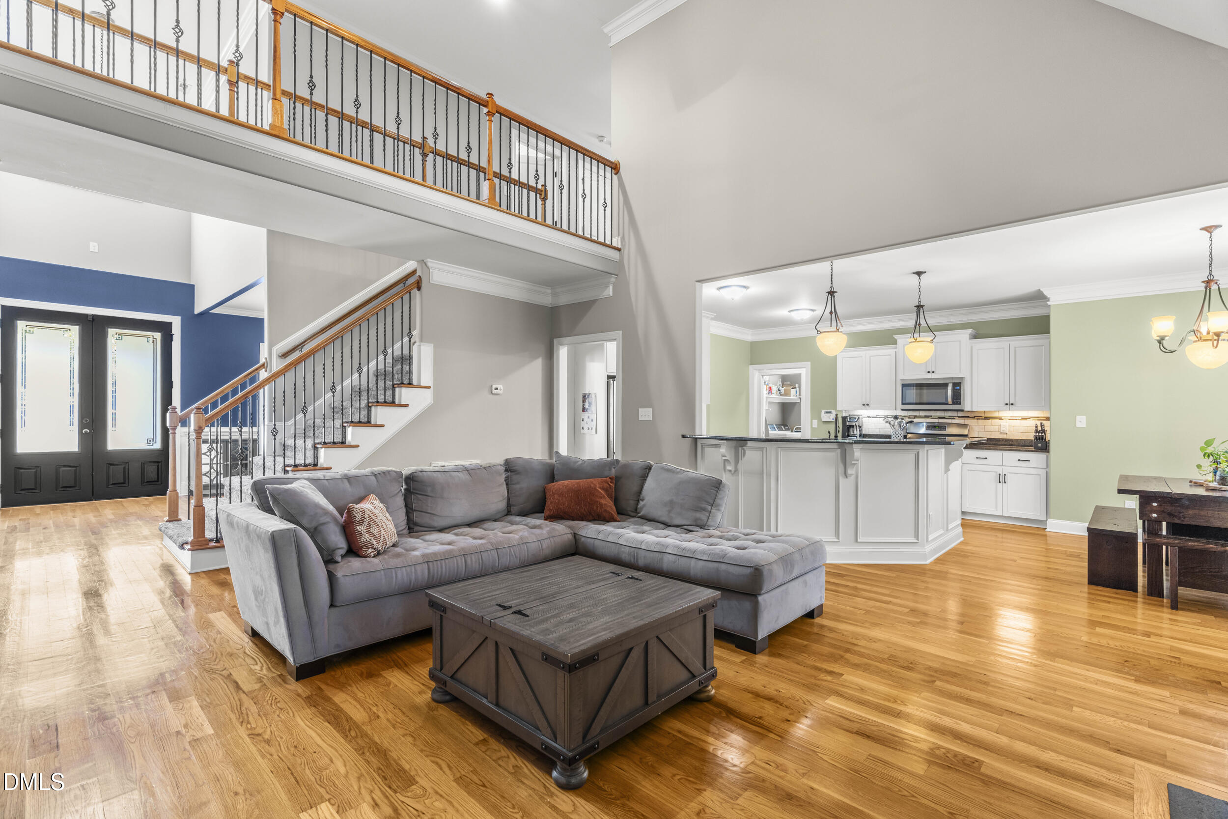 648 Fieldtrial Circle Garner, NC 27529 - Photo 14 of 56 a living room with furniture and kitchen view