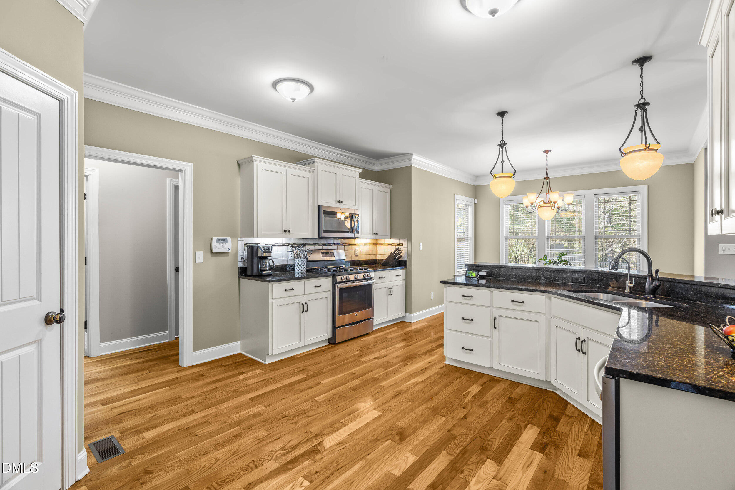648 Fieldtrial Circle Garner, NC 27529 - Photo 20 of 56 a kitchen with a sink stove and refrigerator