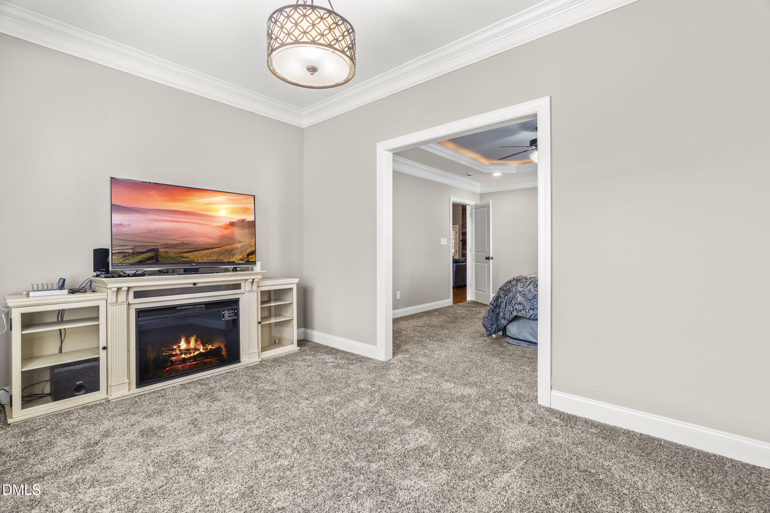 648 Fieldtrial Circle Garner, NC 27529 - Photo 23 of 56 a view of an empty room with furniture and a fireplace
