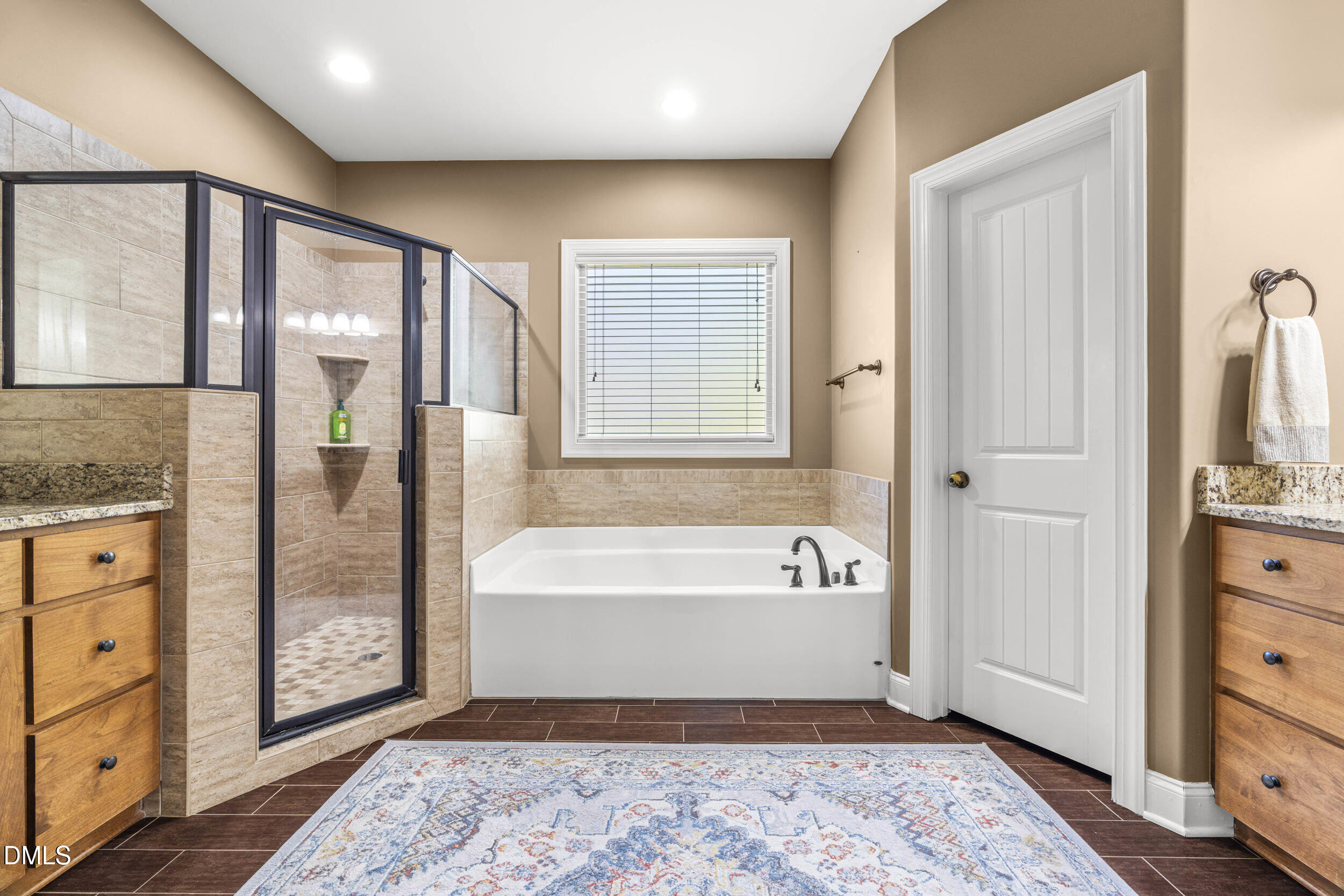 648 Fieldtrial Circle Garner, NC 27529 - Photo 24 of 56 a spacious bathroom with a bathtub and a shower