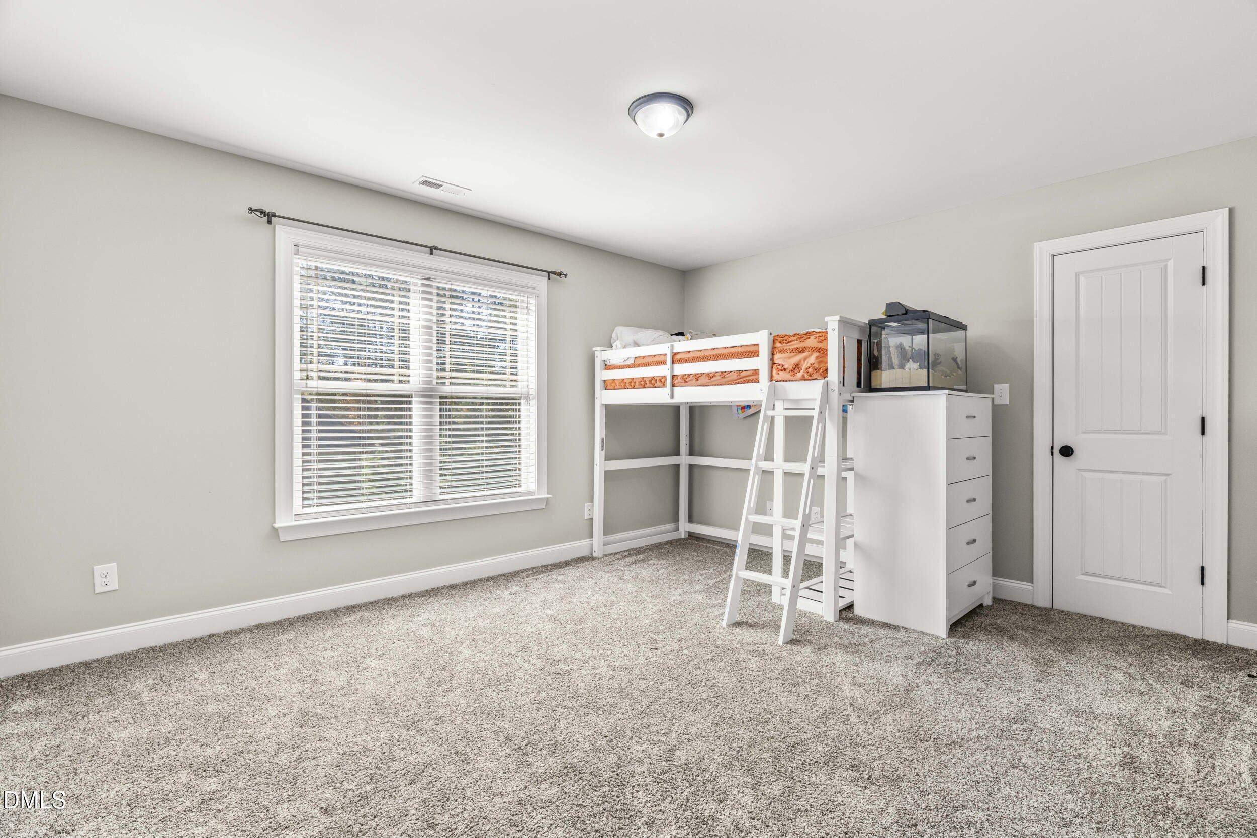 648 Fieldtrial Circle Garner, NC 27529 - Photo 33 of 56 an empty room with a empty space and windows