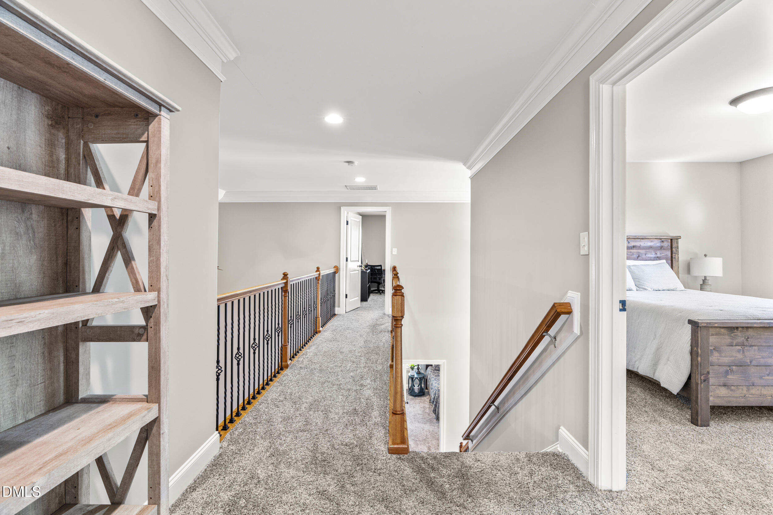 648 Fieldtrial Circle Garner, NC 27529 - Photo 36 of 56 a view of a hallway with windows and stairs