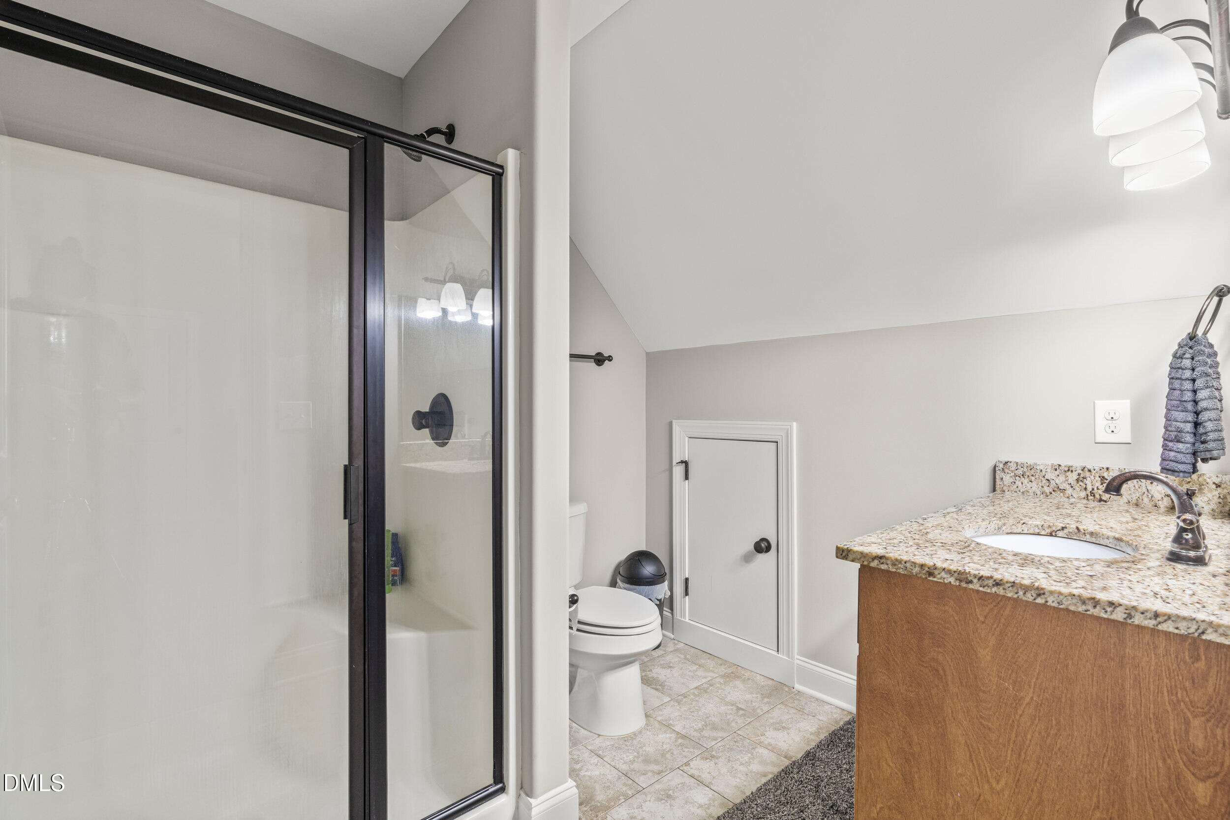 648 Fieldtrial Circle Garner, NC 27529 - Photo 39 of 56 a bathroom with a granite countertop sink toilet and shower