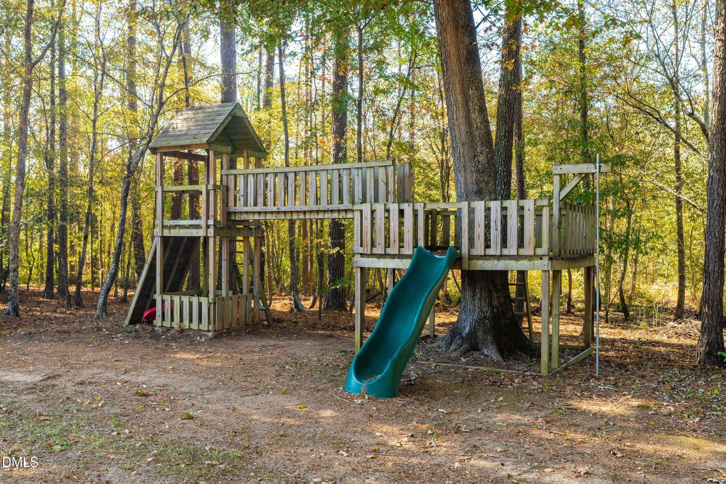 648 Fieldtrial Circle Garner, NC 27529 - Photo 51 of 56 a view of a park with slide